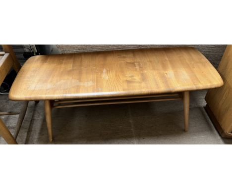 An Ercol coffee table of rectangular form on tapering legs, 105cm wide 