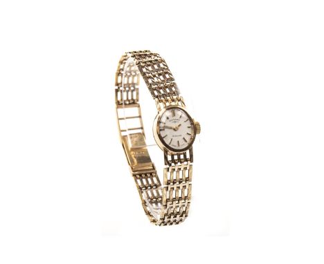 LADY'S ROTARY NINE CARAT GOLD MANUAL WIND WRIST WATCH, the oval dial with applied baton hour markers, index hands, 14mm case,