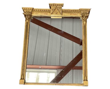 MASONIC INTEREST; a late 19th century gilt framed wall mirror, the pediment decorated with the Masonic square and compass, 56