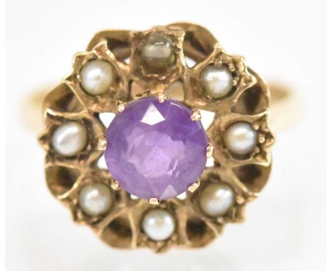 A 9ct yellow gold amethyst and seed pearl set cluster ring, the central amethyst approx 1ct, surrounded by eight small seed p