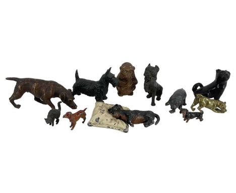 An Austrian cold painted bronze figure of a dog, length 10cm, with various other figures mainly of dogs including miniatures,
