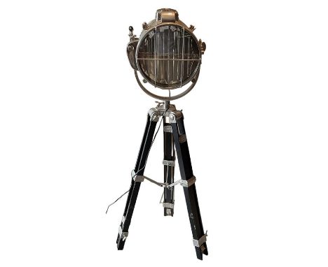 A modern nautical style freestanding lamp, on tripod base, height approx 135cm.