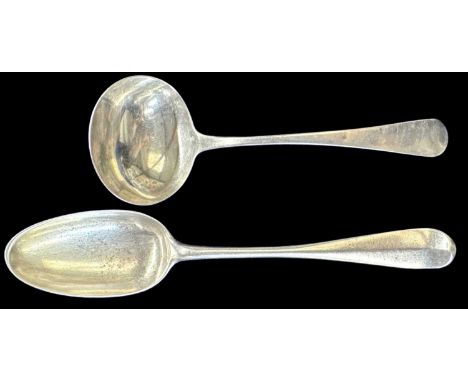 A George III hallmarked silver soup ladle, London 1817, length 17cm, and a further white metal tablespoon, with indistinct ma