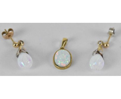 A pair of 9ct yellow gold opal earrings with matching pendant, combined approx 3.7g (3).