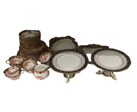ROYAL CROWN DERBY; an Imari decorated part tea service comprising nine teacups, fourteen saucers, ten side plates, two larger