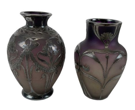 Two Art Nouveau frosted glass vases with white metal overlay, height 12cm and 12.5cm.Condition Report: The larger vase is dam