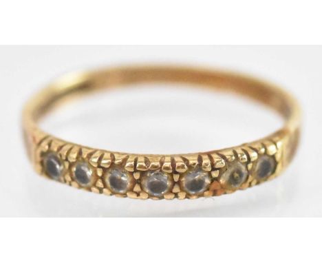 A yellow metal white stone set ring, size N, approx 1.5g.