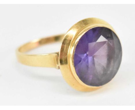 An 18ct yellow gold ring set with large amethyst, size P, approx 6.6g.