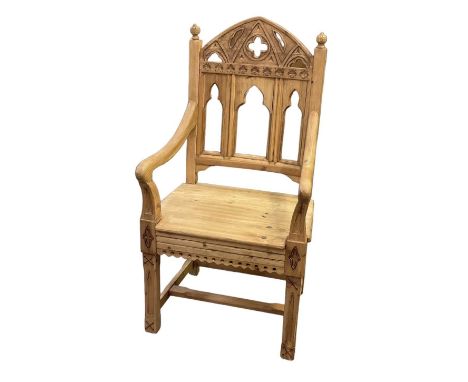 A modern light oak Gothic style Aesthetic Movement elbow chair.