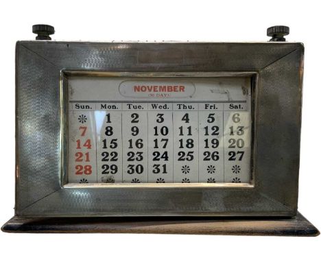A George V hallmarked silver perpetual calendar, Birmingham 1928, width 20cm, height 13.5cm (af).Condition Report: Please not