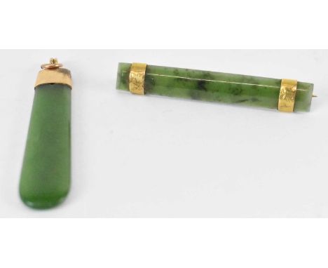 A nephrite jade pendant with 9ct gold mount, length 5cm, also a similar bar brooch (2).
