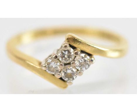 An 18ct yellow gold diamond ring set with four small diamonds, size I, approx 2.5g.