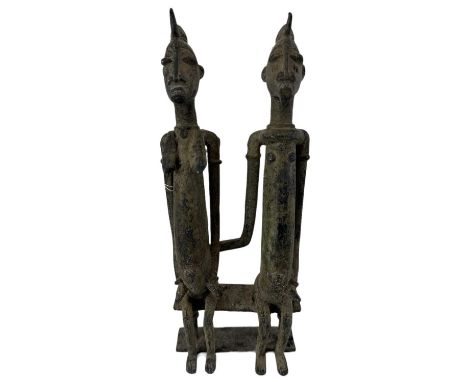 A Benin type bronze model of a seated couple, height 26cm.