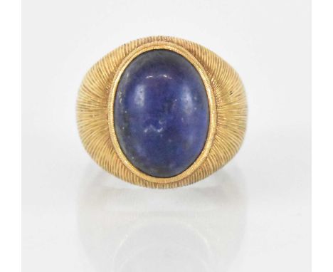 MARIO BUCCELLATI; a chunky yellow metal lapis lazuli set ring, signed 'M. Buccellati', size K, approx 11g.Condition Report: T