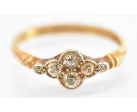 A 9ct yellow gold diamond ring set with two diamonds flanked by a pair of smaller diamonds and a further pair of diamonds, si