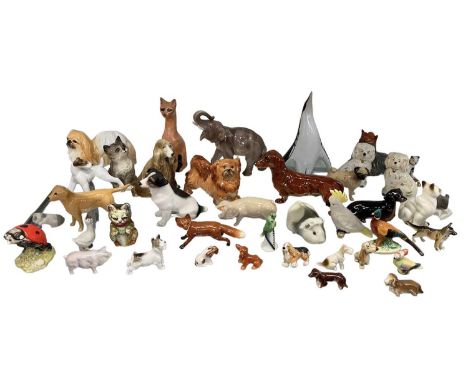 A collection of approximately forty assorted figures of animals including Beswick, Royal Albert, Royal Copenhagen and Goebel.