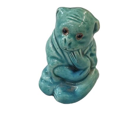 BURMANTOFTS; a turquoise glazed figure of a seated monkey, no. 1996, height 6.5cm.