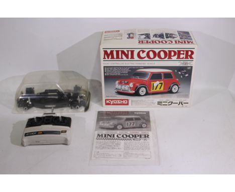 Kyosho - A boxed partially assembled Kyosho #16800 1:10 scale electric RC Mini Cooper Kit. The kit comes with unpainted body 