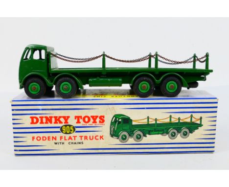 Dinky - A boxed Foden Flat Truck with chains # 905. The model shows only very light signs of age and use and would benefit fr