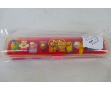 Polly Pocket - Bluebird - An unboxed vintage 1989 'Polly Pocket - Ring Collecting Case'. The set contains 10 rings and appear