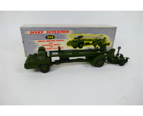 Dinky - A boxed Missile Erector Vehicle with Launching Platform # 666. The model appears in Very Good condition with light si