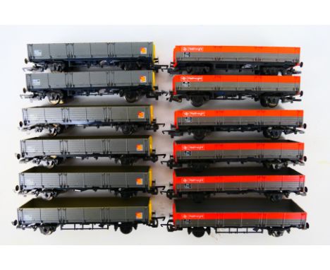 Hornby - 12 x unboxed OO gauge wagons, six OAA 45 ton open wagons # R067 and six Railfreight open wagons # R248. They show li