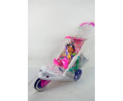 Cabbage Patch Kids - An unboxed vintage Cabbage Patch Kid in a Cabbage Patch 'Bubble'  stroller / pram. The doll appears to b