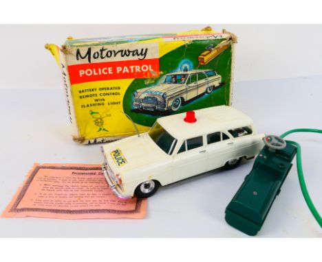 Louis Marx - A boxed 1960s Ford Zephyr Motorway Patrol car with flashing light. The model appears in Very Good condition with