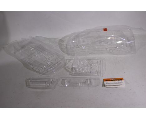 Tamiya - HPI Racing - Two RC body shells. Lot consists of a reproduction Tamiya 1:12 Porsche 959; with an HPI 1:10 Racing Mit