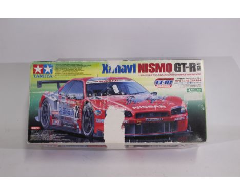 Kyosho - An Kyosho Lazer ZX chassis with a small quantity of spare parts. The chassis has signs of wear appearing to be in Go