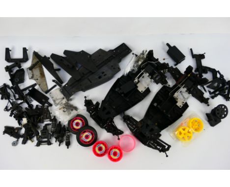 Kyosho - Other - A quantity of loose Kyosho electric RC chassis, chassis plates and loose wheels and tyres. Items all show si