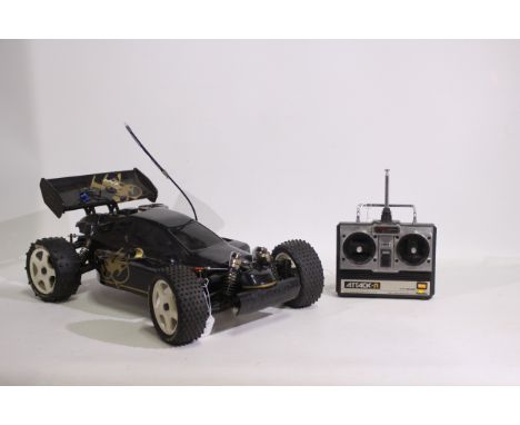 Kyosho - An unboxed Kyosho 1:8 scale nitro RC Turbo Burns Buggy. The model has swing labels fitted which appear to suggest th