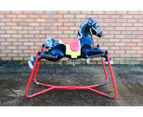 Mobo - A vintage Mobo black spring rocking horse. The horse shows age and play wear appearing Fair Plus overall. (This does n