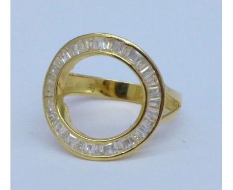 A silver gilt and white stone circle ring, R