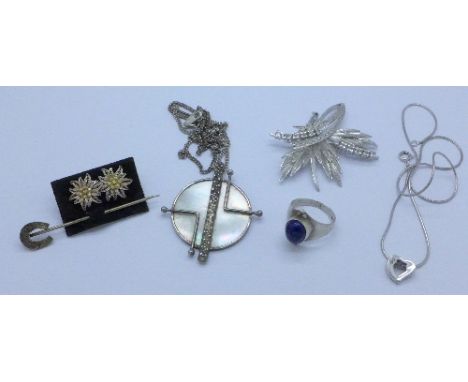 A paste set brooch, two silver pendants and chains, a ring, earrings and a stick pin