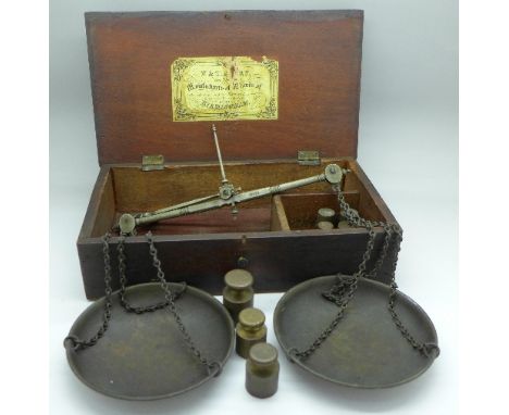 A set of 19th Century balance scales with weights, boxed, the scales, some weights and box marked Avery