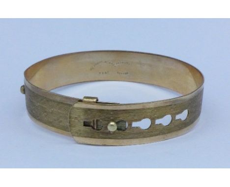 A 9ct gold back and front bangle