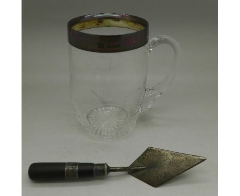 A Victorian silver rimmed glass mug, London 1887 and a small silver trowel letter opener