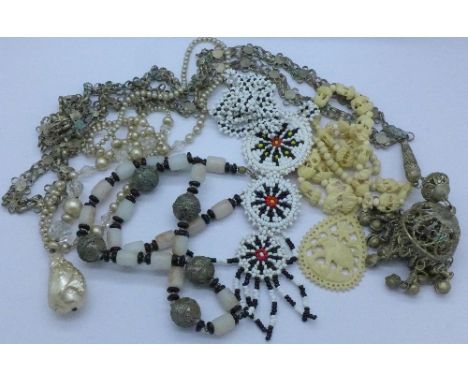 A carved necklace and other vintage necklaces