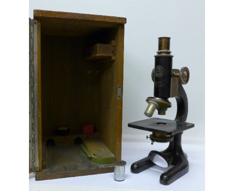 An early 20th Century microscope, C. Baker, London, cased