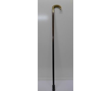 A horn handled walking stick with a silver mount, London 1938