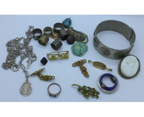 Vintage jewellery including a yellow metal mounted turquoise pendant and a bangle with mounted sixpences