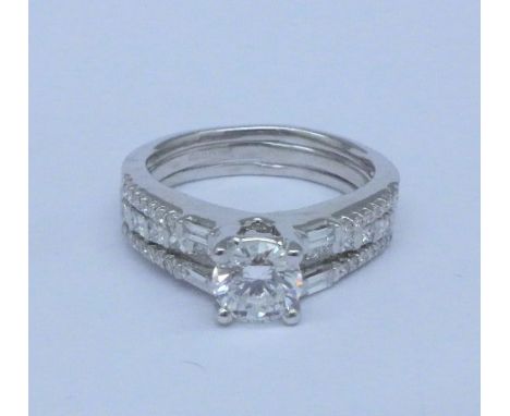 An 18ct gold and diamond solitaire engagement ring and wedding ring set, 5.9g, K, centre stone approximately 0.7 carat, colou