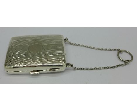 A silver combination cigarette case, match holder and hinged compact with mirror and puff, Birmingham 1947