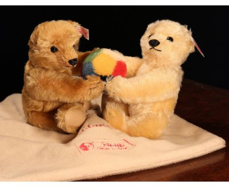 Steiff (Germany) EAN 671517 pair of teddy bears with ball (Deutschland 2003), each with trademark 'Steiff' buttons to ears an