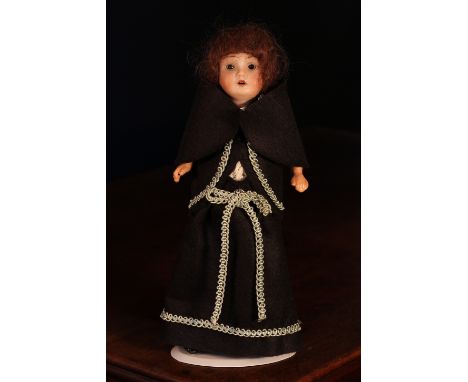 A Theodore Recknagel (Germany) bisque head and painted composition bodied doll, the bisque head with weighted sleeping brown 