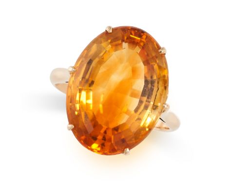 A VINTAGE CITRINE RING in 18ct yellow gold, set with an oval cut citrine of approximately 12.66 carats, stamped 18CT, size P 