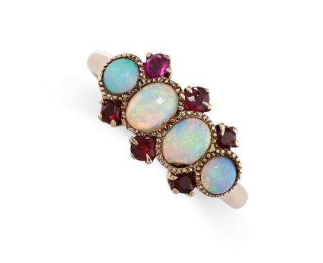 AN OPAL AND RUBY RING set with four cabochon opals accented by round cut rubies, stamped 10K, size N / 6.5, 2.4g.