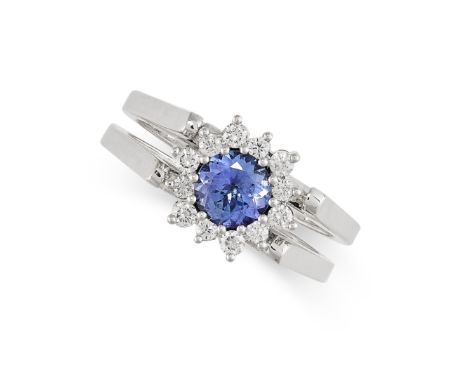 A TANZANITE AND DIAMOND REVERSIBLE RING in 14ct white gold, the hinged band reversible to show two different sides of the hea