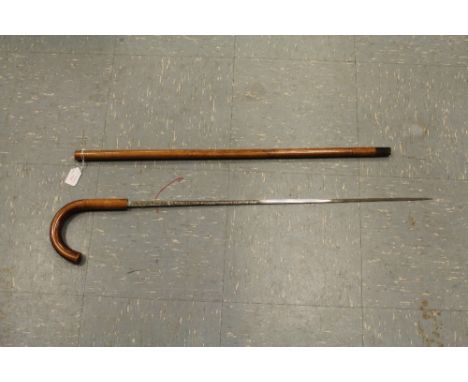 An early 20th Century Toledo sword stick with curved walking stick handle having a twist lock mechanism and etched decoration